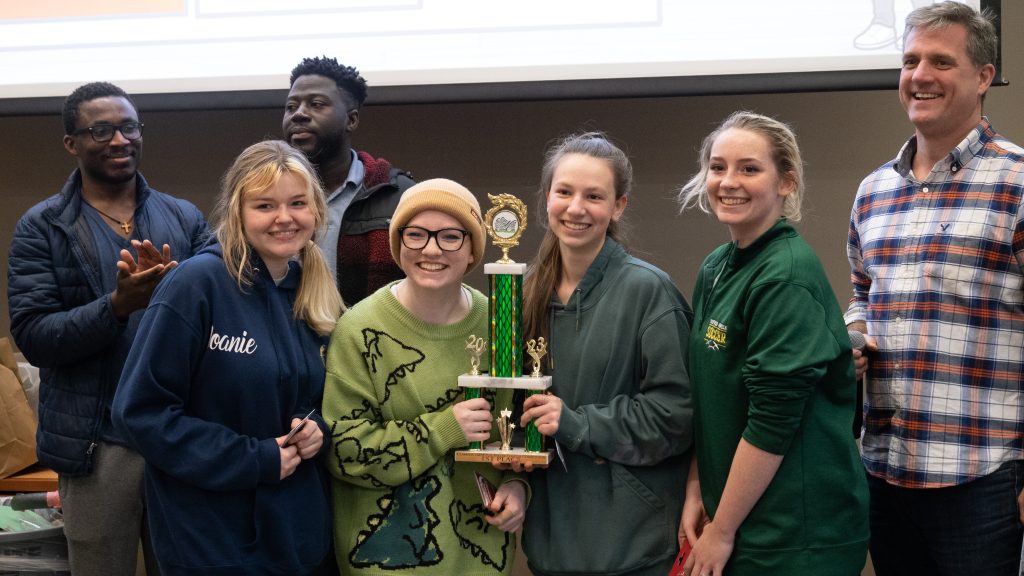 Winning student team from Harrisville, NY collects the 1st place trophy in the IMPETUS Roller Coaster Build competition on April 5, 2023