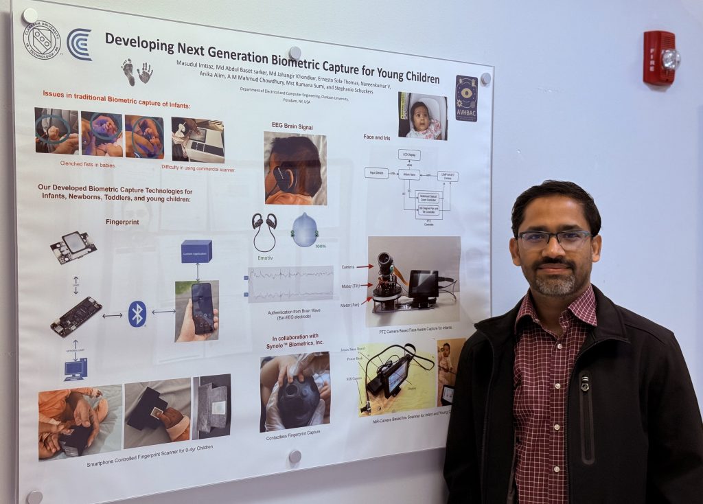 Dr Imtiaz in front of a poster describing his child biometric research