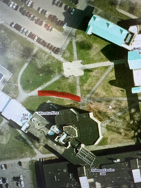 Aerial photo of a portion of Clarkson University's campus with a portion of sidewalk highlighted red to indicate a closed area.