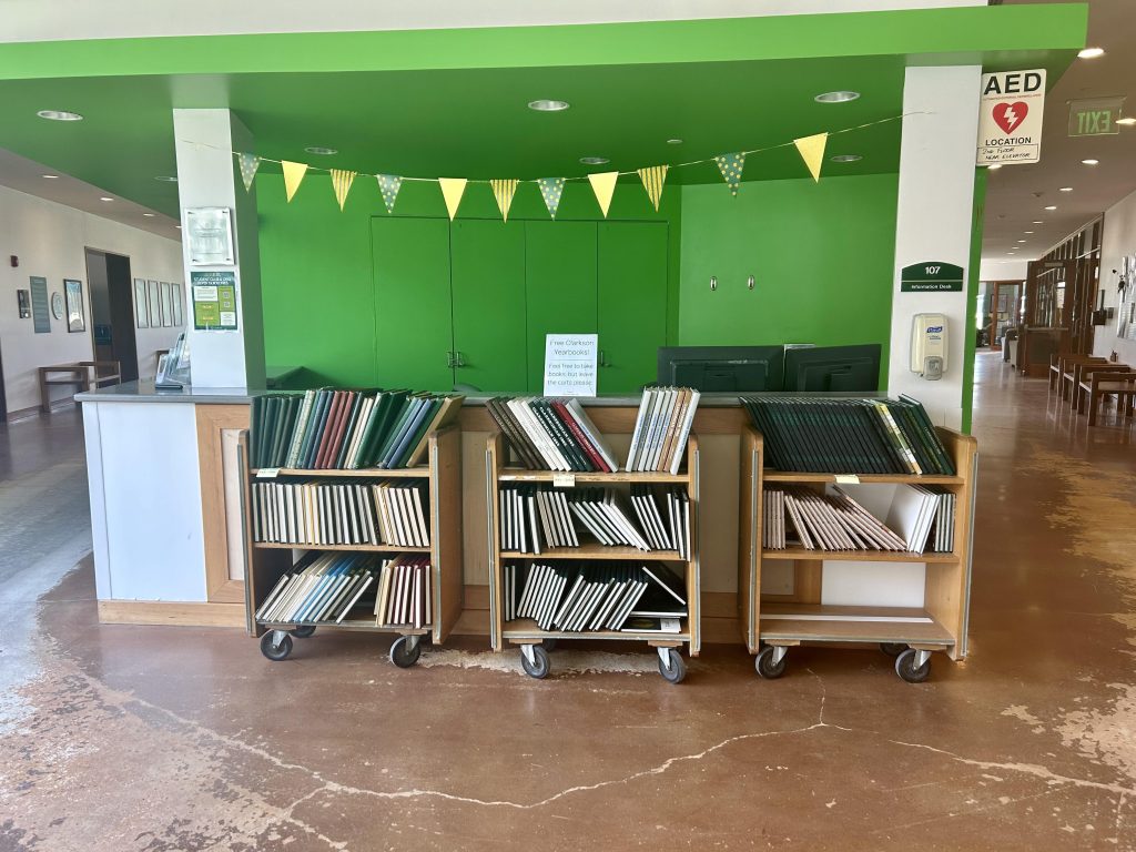 Dozens of yearbooks sit on library carts