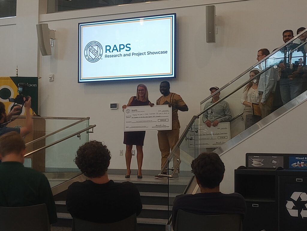 Willam Annan receiving a cash prize for Best Graduate Poster Pitch in last weeks summer RAPS conference.
