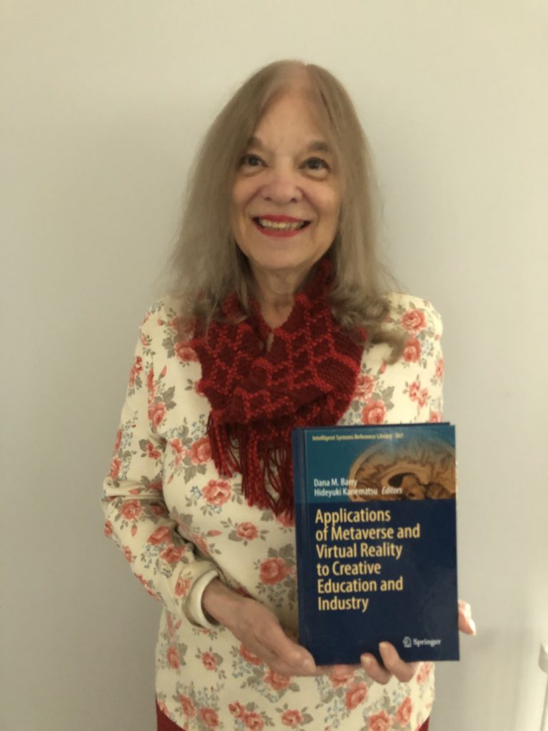 Clarkson Research Professor Dana Barry proudly displays her new 2025 Springer Nature publication.