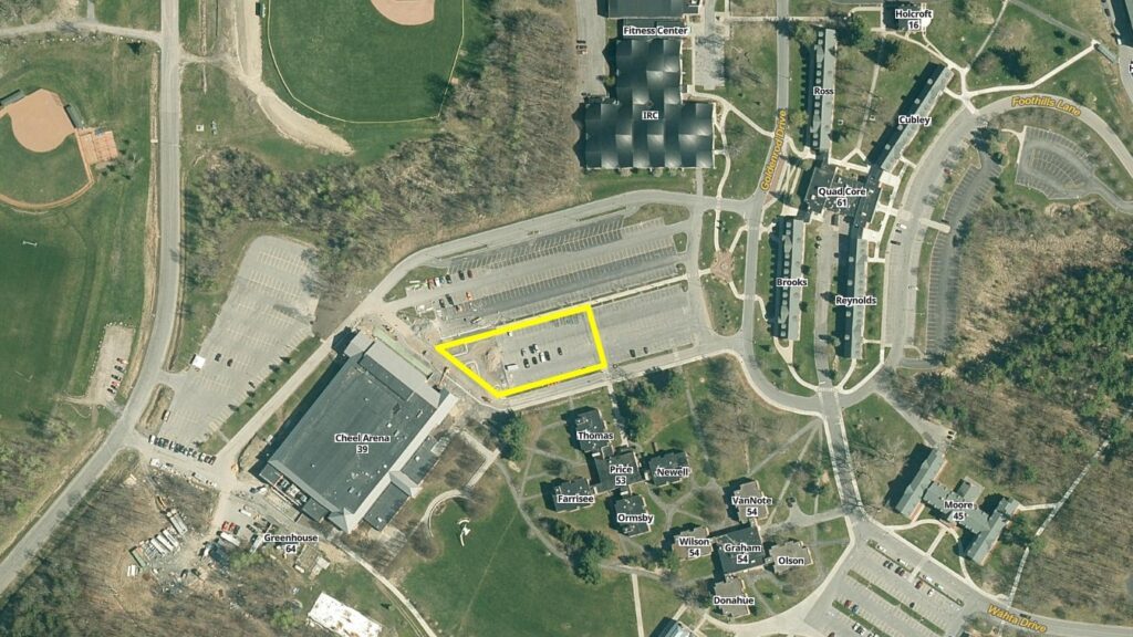 Aerial Image of Clarkson campus showing restricted parking area in Upper Cheel parking lot outlined in yellow.