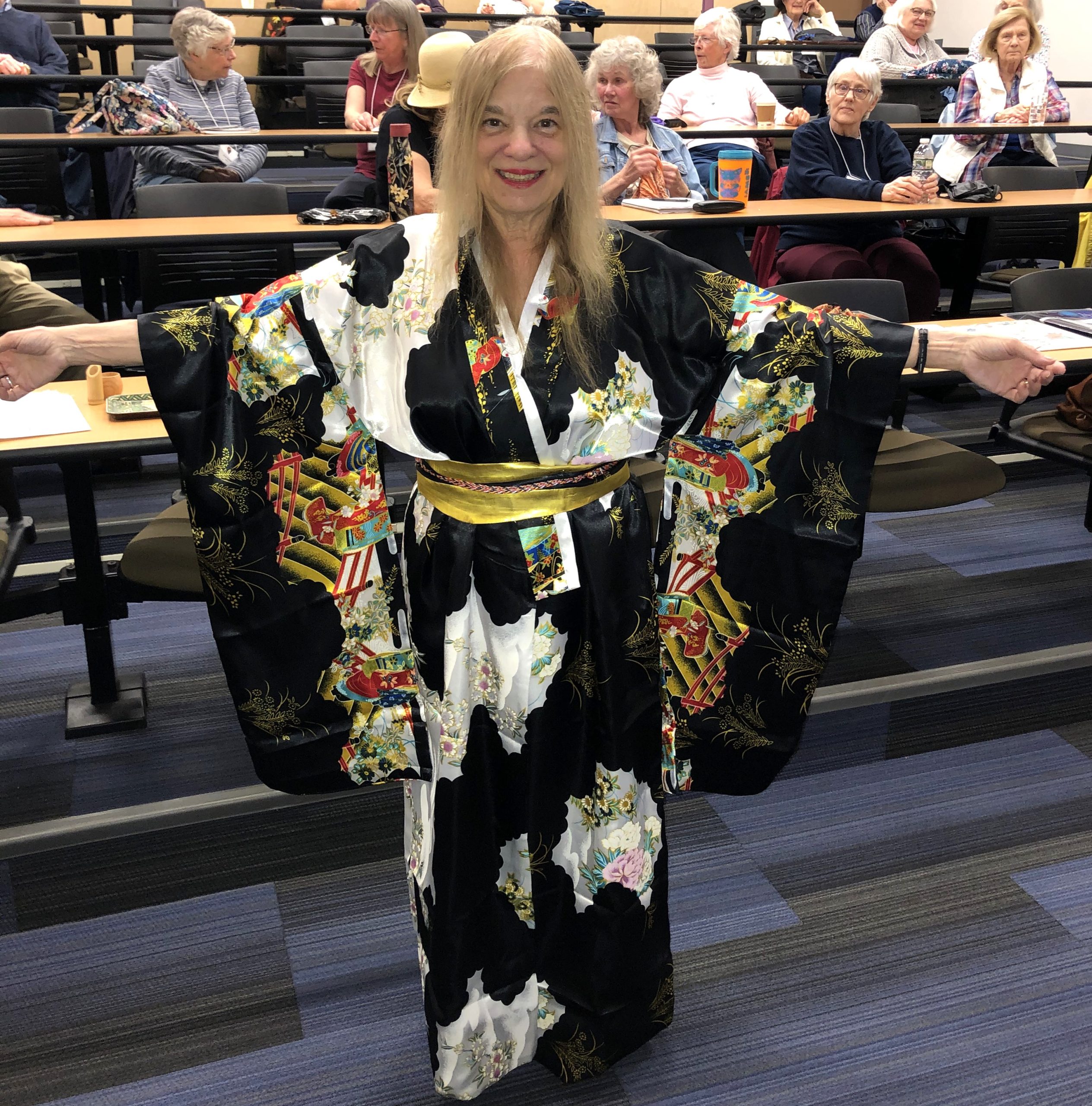Dana Barry Displays her Kimono while giving a presentation about Japan.