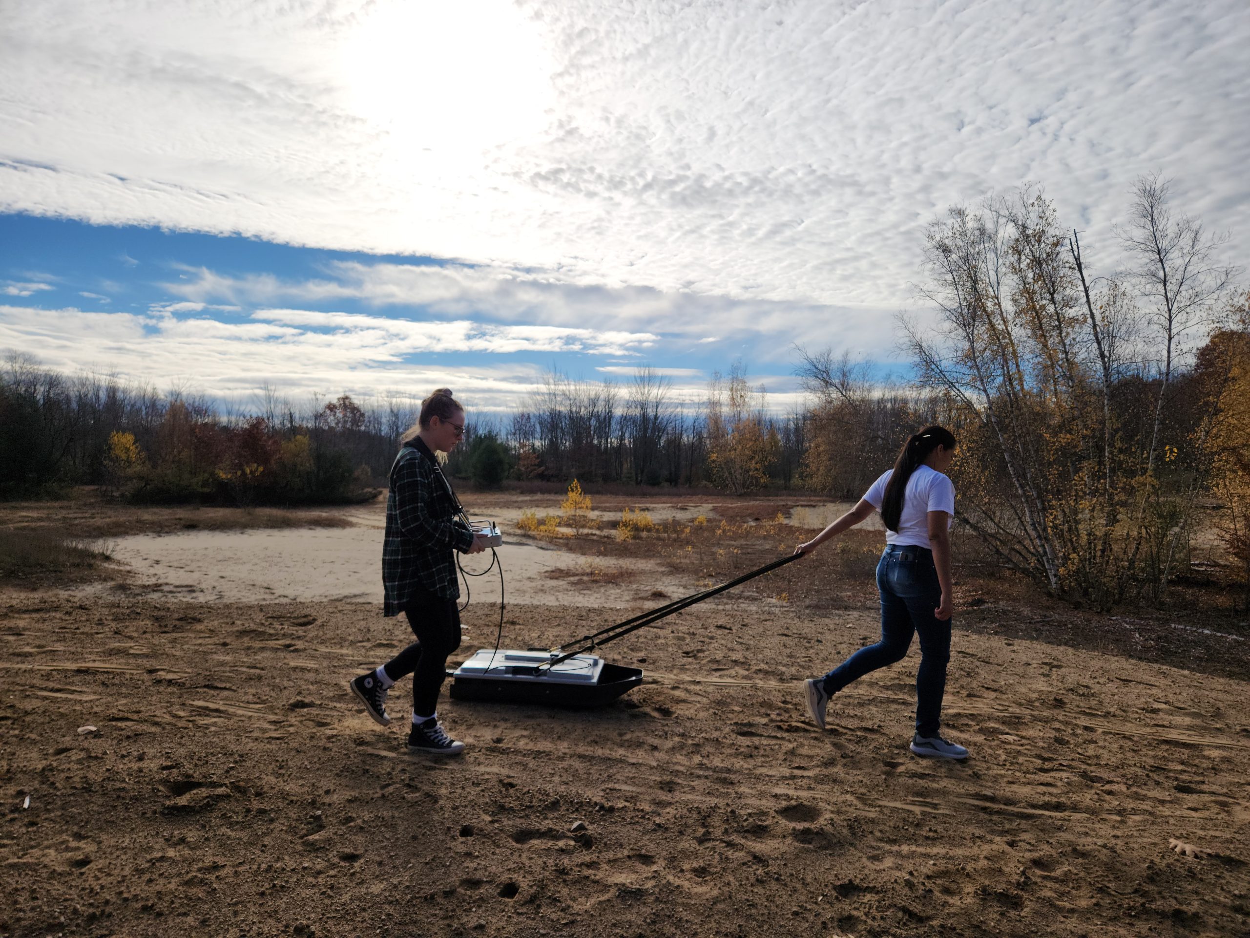 Gladys Pantoja, a Clarkson University PhD student, tows a GPR in Potsdam to explore ancient sand dunes which are remnants of the prehistoric Champlain Sea coastline.